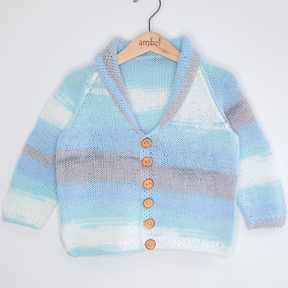 Retro vibes cardigan in self striping cotton yarn with wooden buttons, perfect for small children.