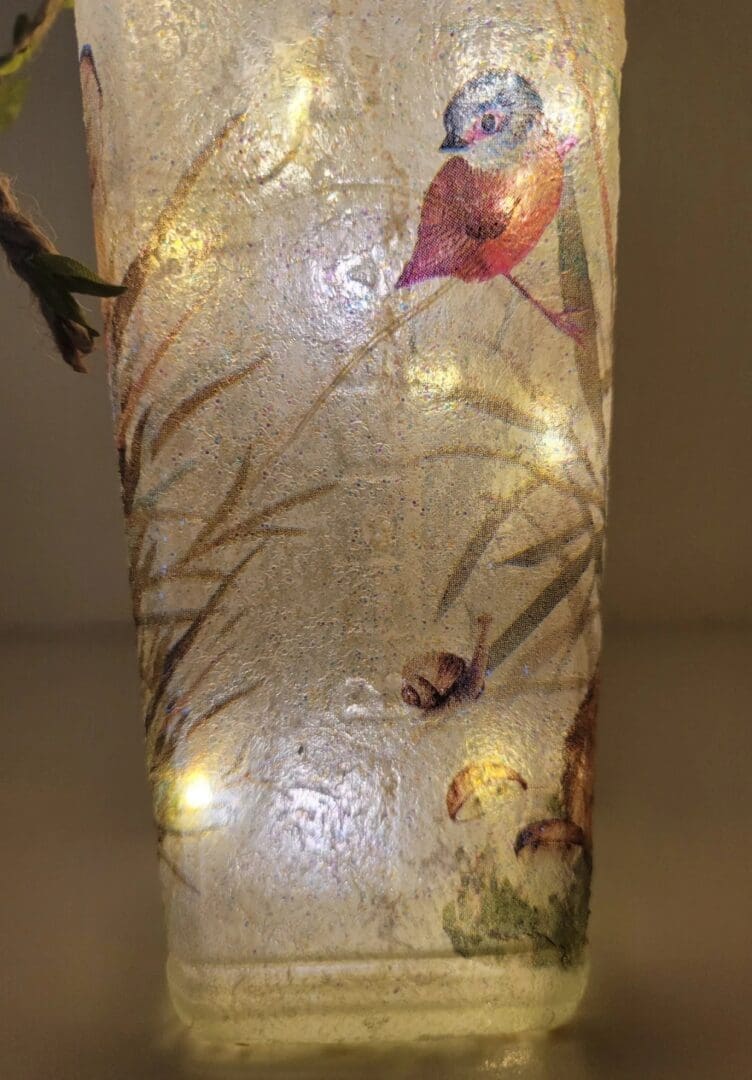 Lit up Square glass gin bottle with bird and leaf detailing