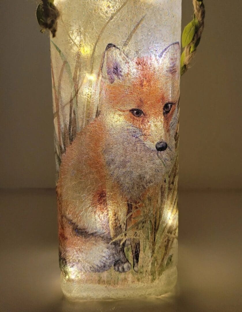 Lit up Square glass gin bottle with fox detailing.