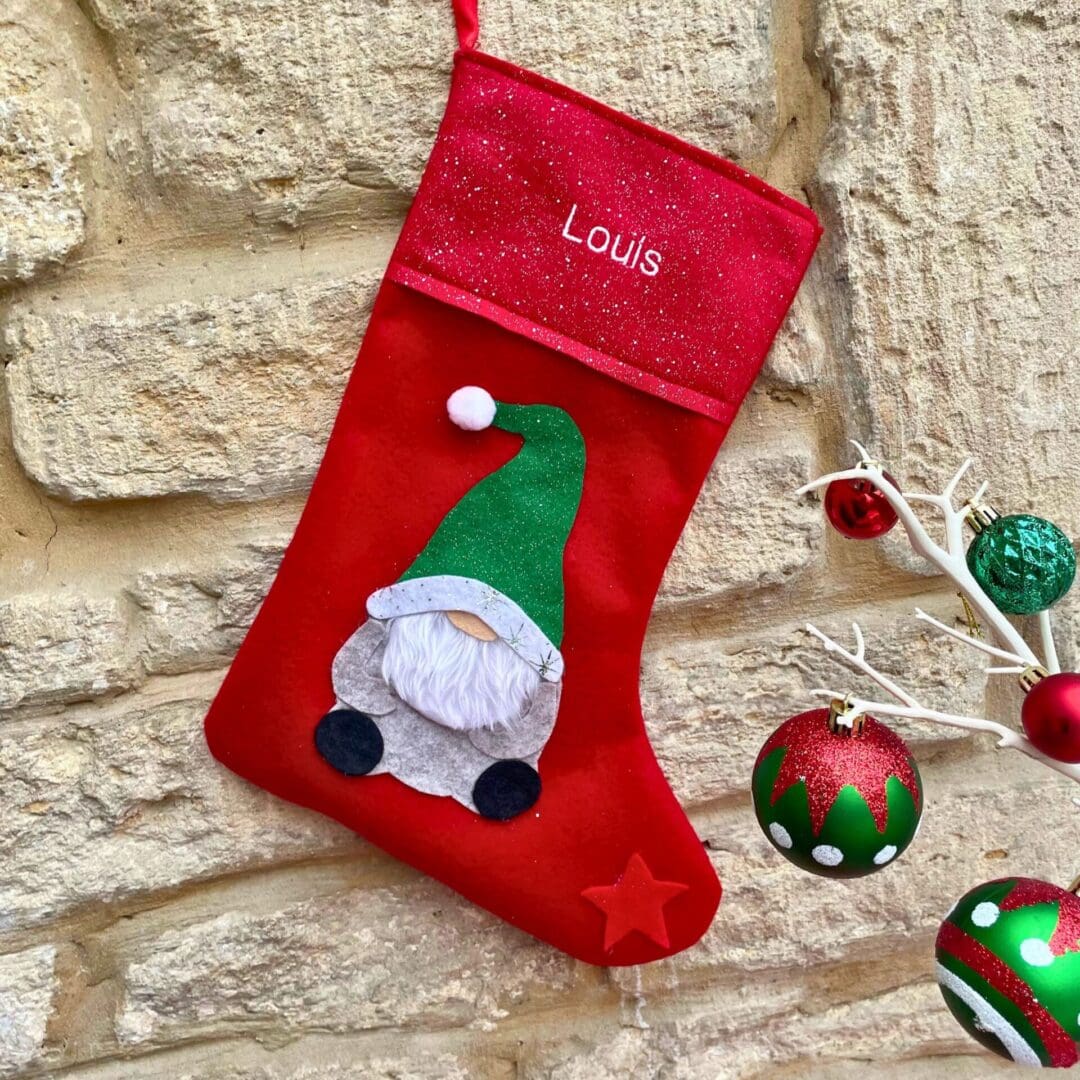 Christmas Stocking with a Boy Gonk wearing a green sparkly hat