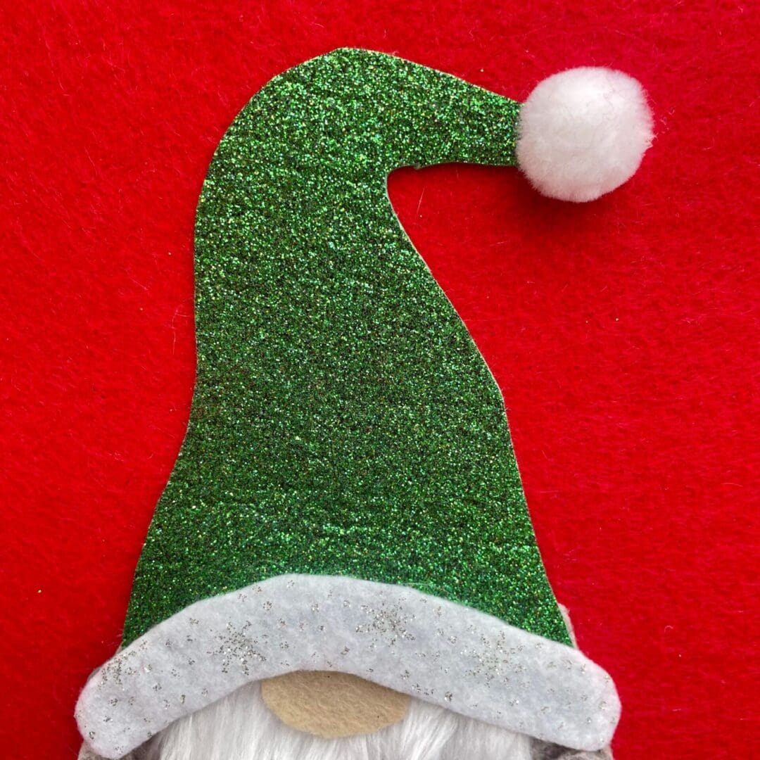 Christmas Stocking with a Boy Gonk wearing a green sparkly hat