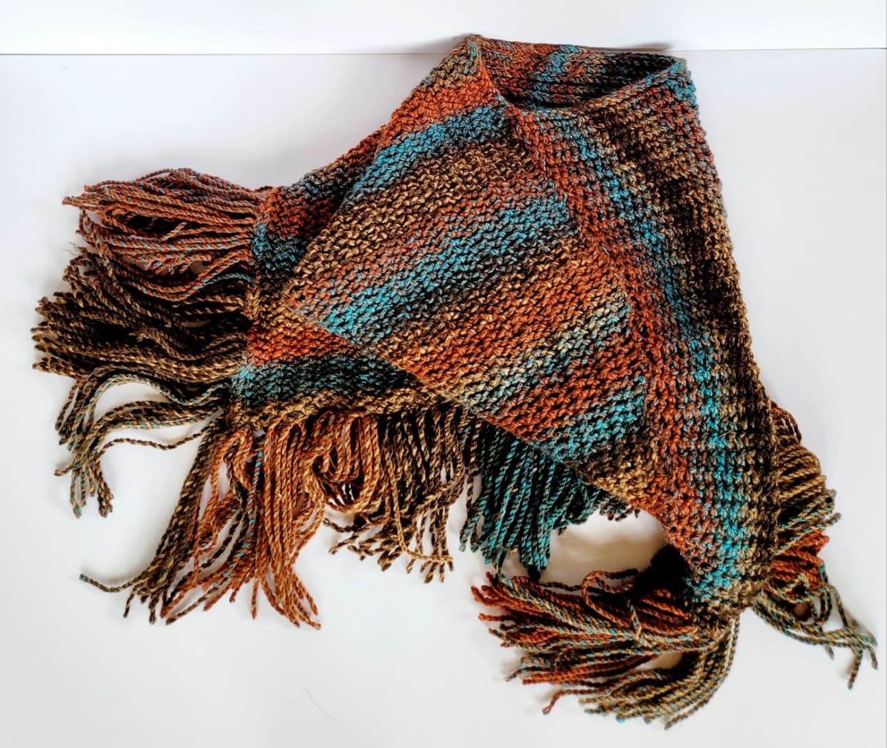 brown and blue striped poncho with long tassels