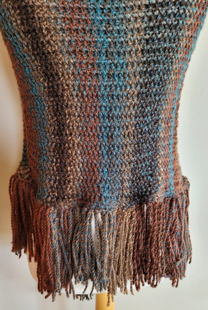 Brown and blue striped poncho