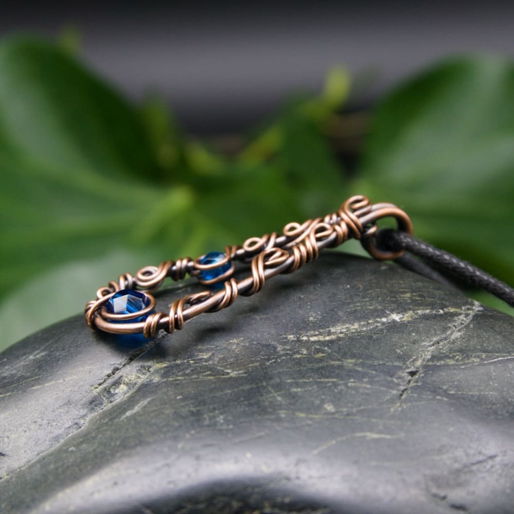 Copper wire pendant with Capri blue glass beads by Oruki Design