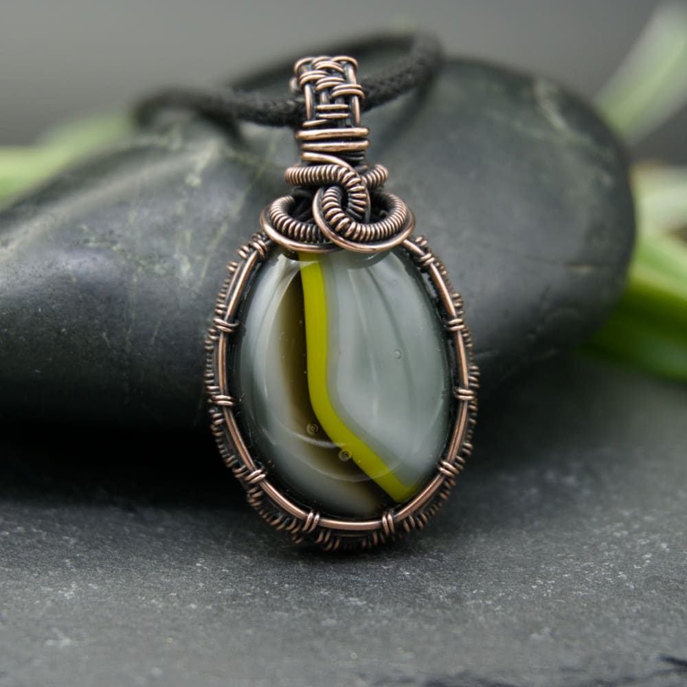 Copper wire wrap pendant with striped grey and yellow fused glass by Oruki Design