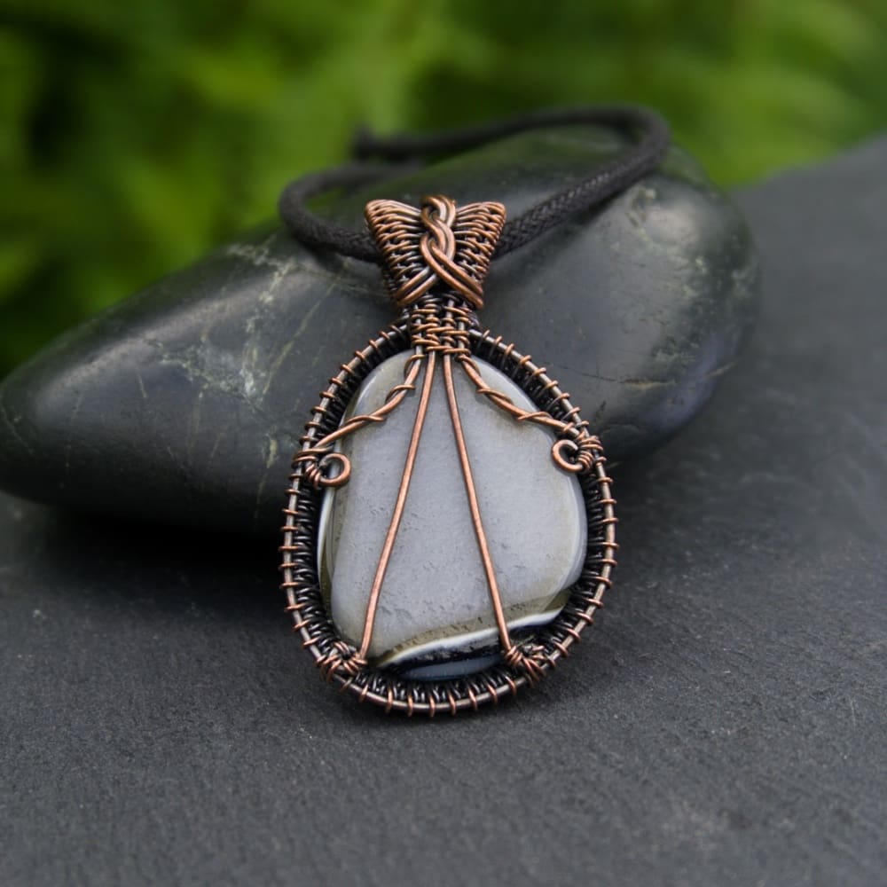 Back of a copper wire wrapped fused glass pendant by Oruki Design