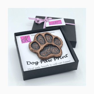 Hand made Dog paw print brooch in cold-cast copper, pewter or bronze by animal sculptor Kirsty Armstrong.