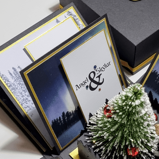 Black & gold Exploding Box for a surprise Lapland holiday focused on the inner most panel that hold trip itinerary & personal message.