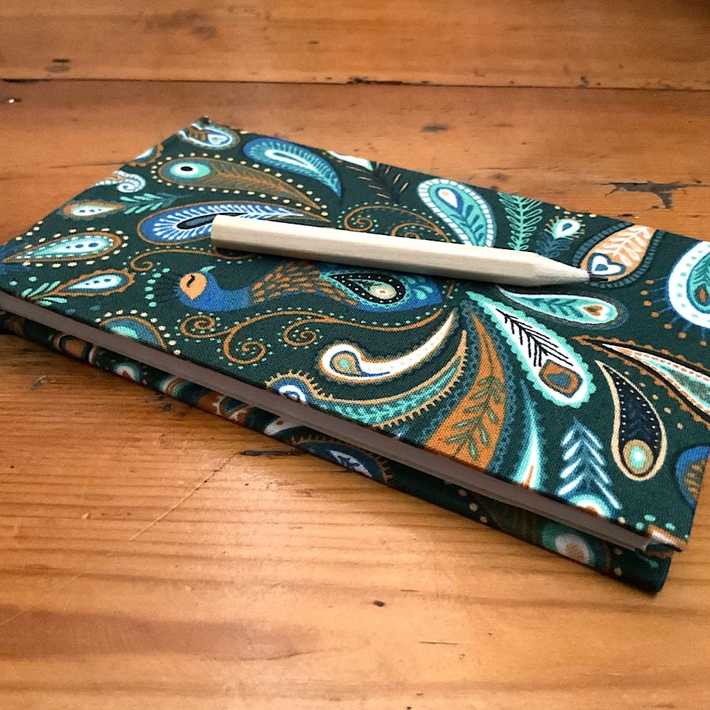 Handmade Jotter Notebook covered in fabric with attached pencil