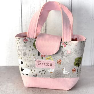 Personalised childs toy bag featuring farmyard animals