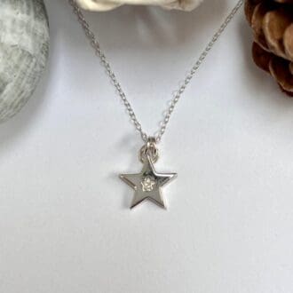 Handmade silver star necklace set with star shaped cubic zirconia gemstone