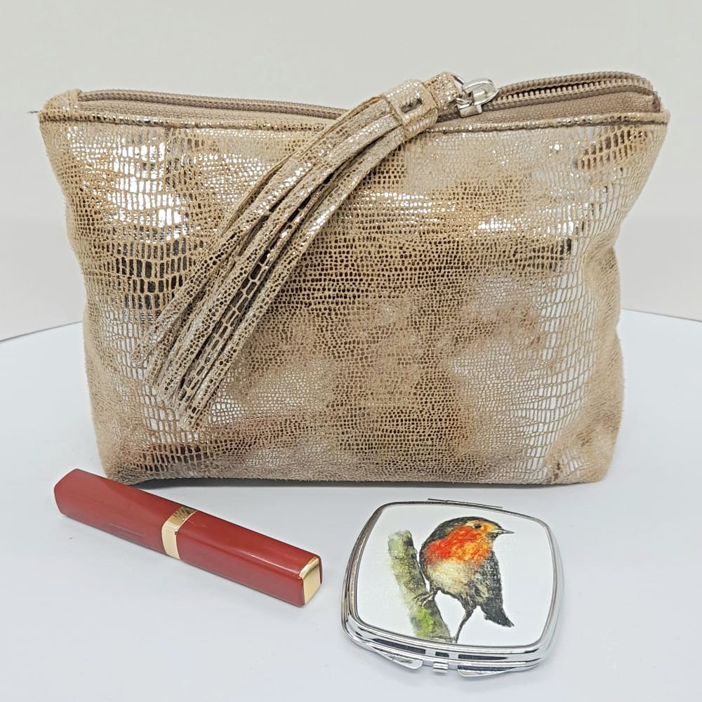 Robin mirror compact displayed with make up bag and lipstick