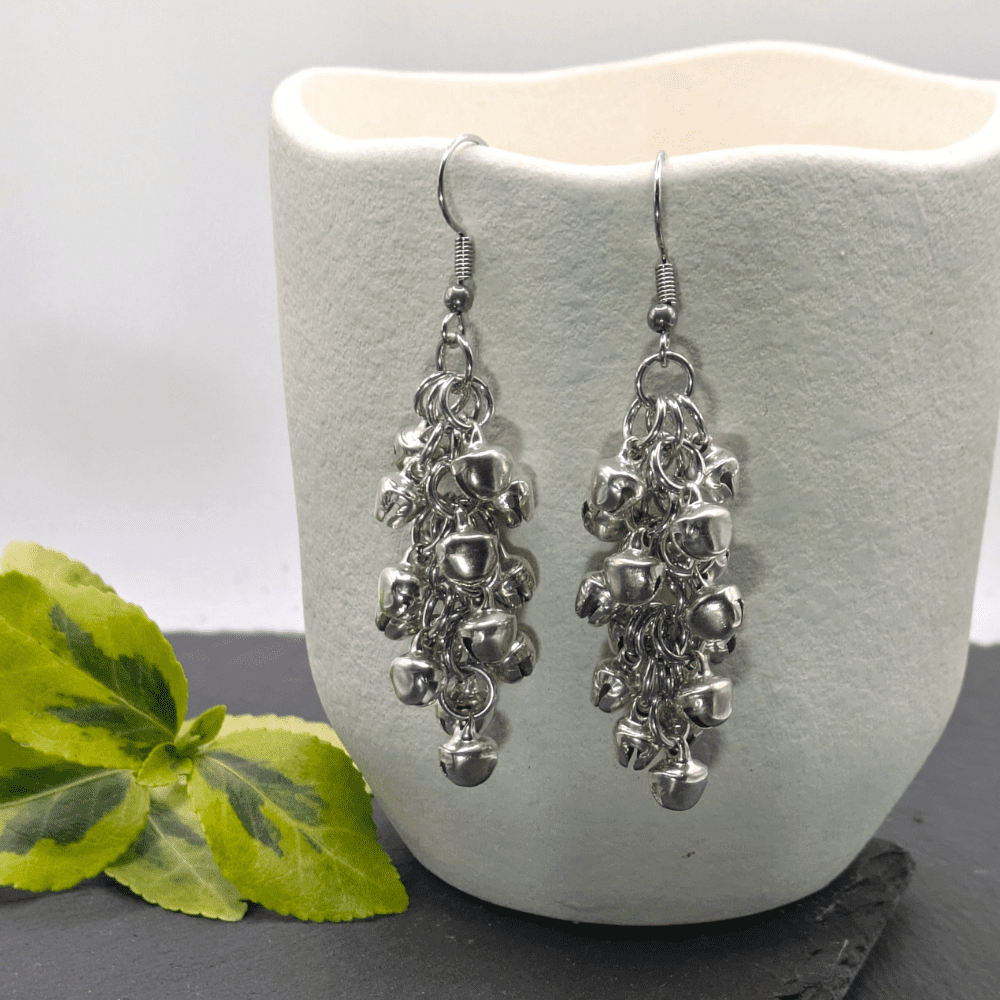 Shaggy loops chainmaille earrings made with lots of tiny silver bells added to individual rings