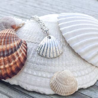 Clamshell pendant handcrafted from fine silver