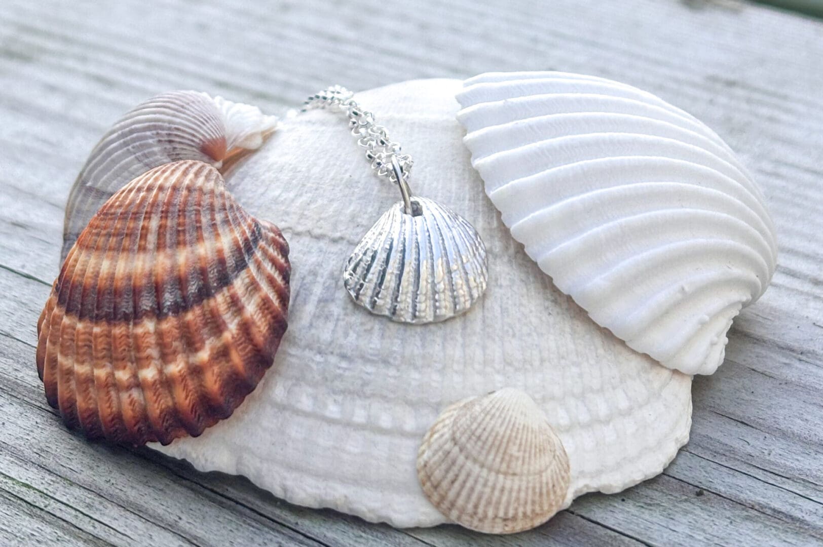 Clamshell pendant handcrafted from fine silver