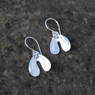 silver earrings in shape of mistletoe leaf with tiny berries.