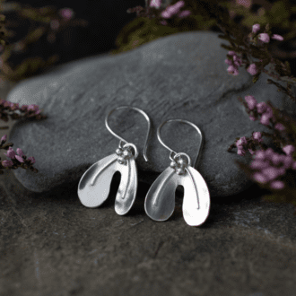 silver dangle earrings shaped like mistletoe leaves with tiny berries