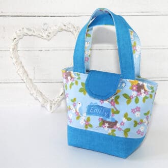 Childs toy bag in blue bird fabric with personalisation