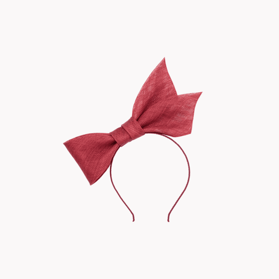 sinamay bow mounted on headband in burgundy red