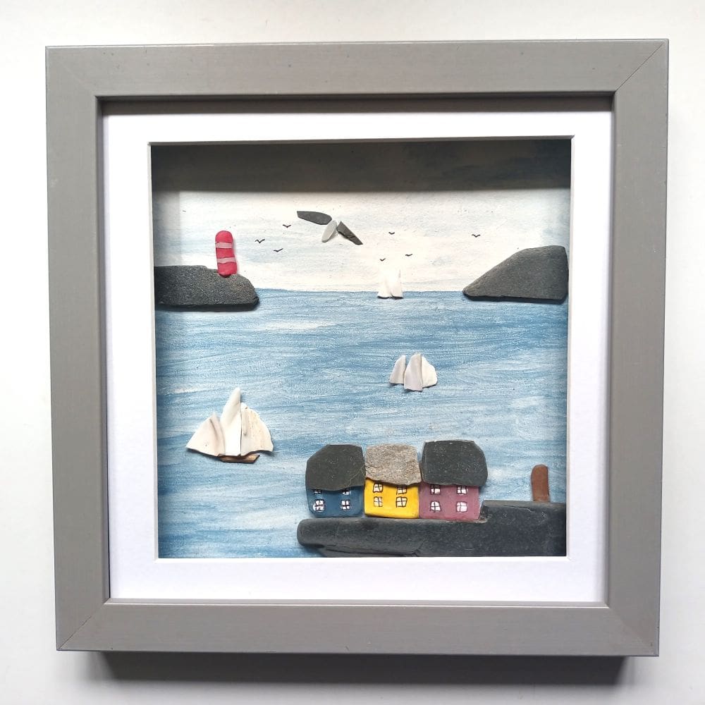 framed picture of a Cornish coastal scene made with beachcombed finds