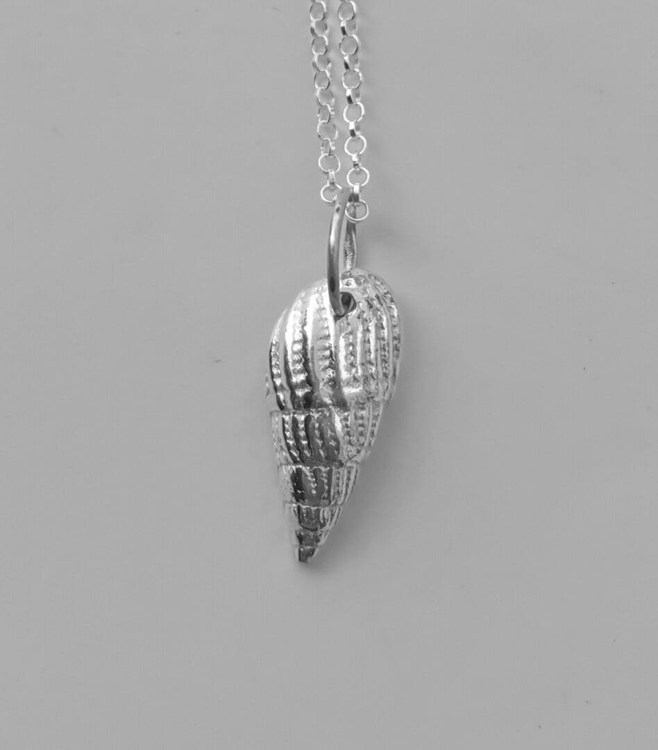 Shell pendant handcrafted from fine silver