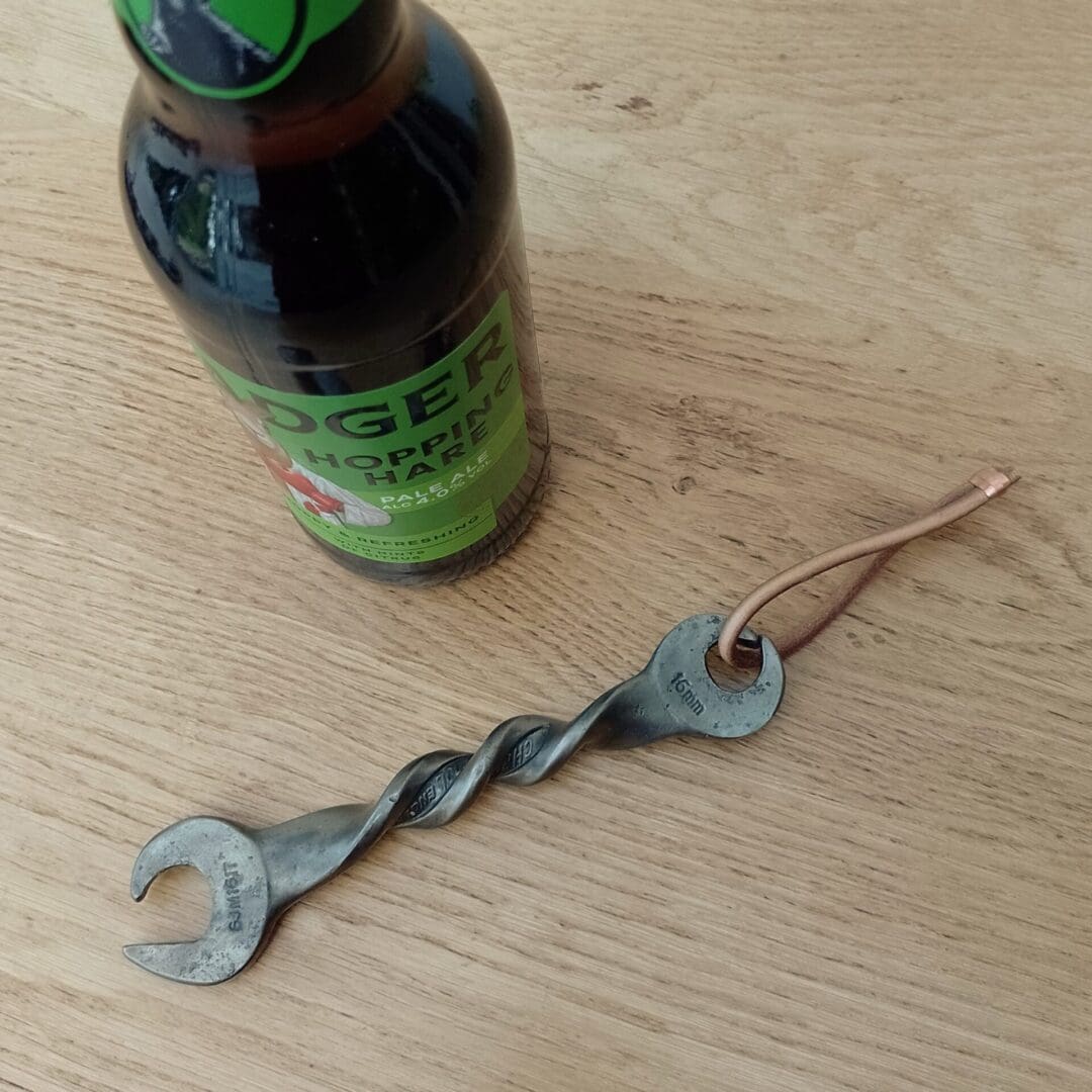 Spanner bottle opener. This is an old spanner that has been heated in the forge and re purposed into a bottle opener