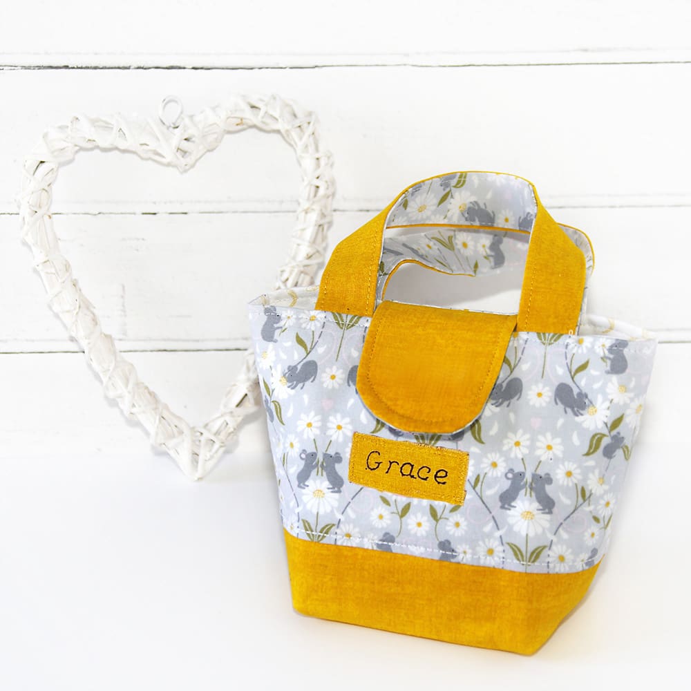 Personalised toy bag for child in yellow with daisies and mice fabric print