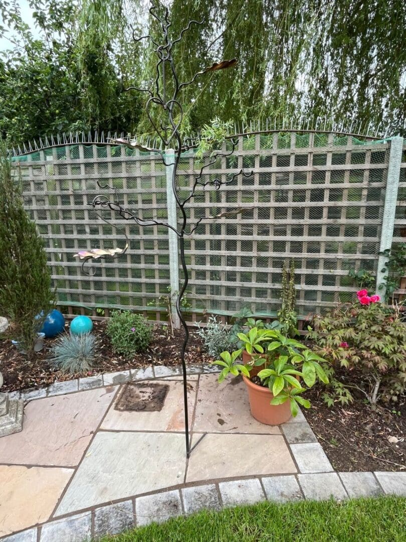 Bird feeder tree bird feeding stand with 3 colourful stainless steel Oak leaves. Leaves can be engraved and personalised for weddings, steel and iron wedding anniversaries. Personalised retirement gifts, personalised memorial gifts and garden gifts