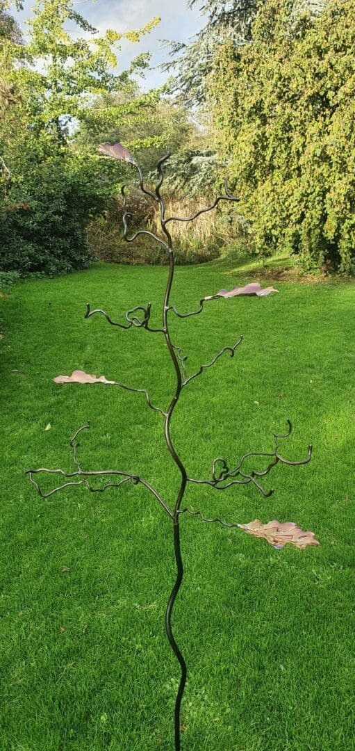 Bird feeder stand with 4 colourful oak leaves in patinated stainless steel, family tree, memorial tree to remember loved persons and pets, can be engraved and personalised. Robust and artistic garden art which the birds love