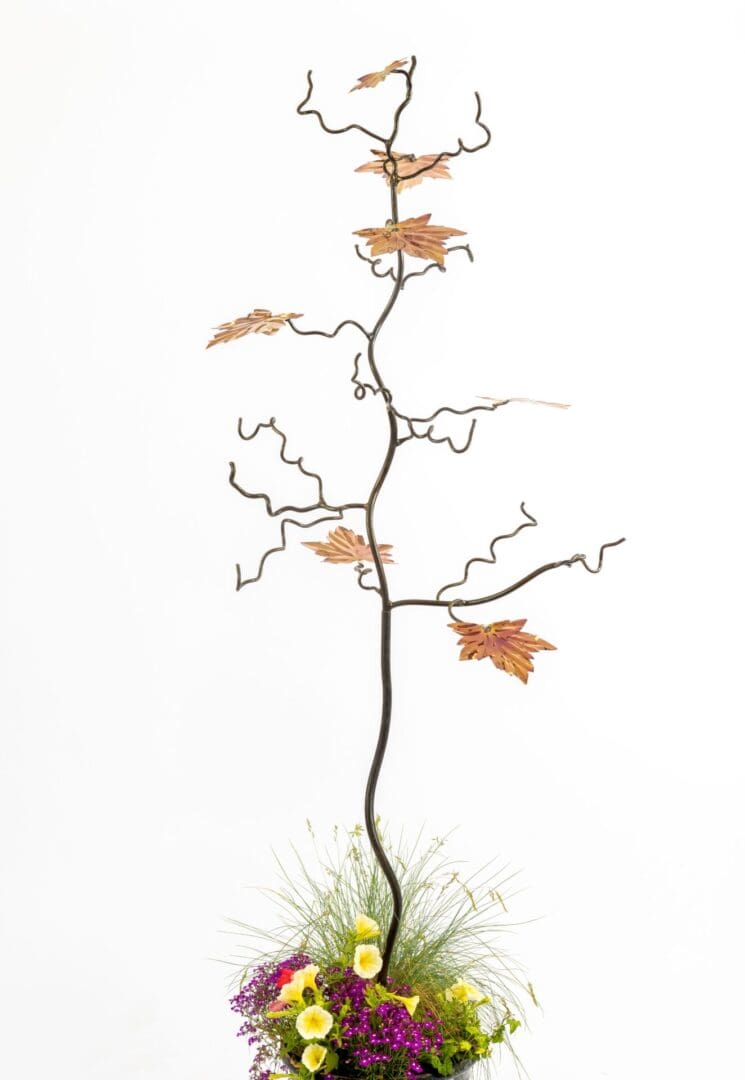 7 Maple leaf tree sculpture with 7 marine grade stainless steel colourful leaves. bird feeder, gift for gardeners and gift for bird lovers, Chelsea Flower Show, RHS Wisley, designed by Mark Reed, bird feeder stand. Iron and steel wedding anniversary.