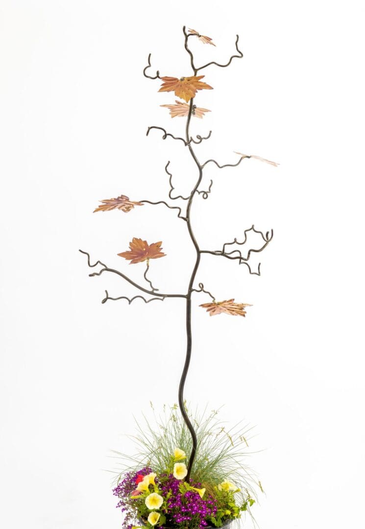 7 Maple leaf tree sculpture with 7 marine grade stainless steel colourful leaves. bird feeder, gift for gardeners and gift for bird lovers, Chelsea Flower Show, RHS Wisley, designed by Mark Reed, bird feeder stand. Iron and steel wedding anniversary.