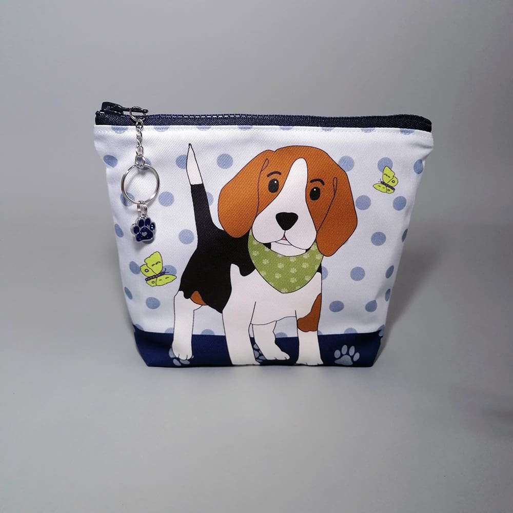 Delightful makeup bag is crafted from soft, premium cotton and showcases an endearing pup sporting a vibrant bandana print