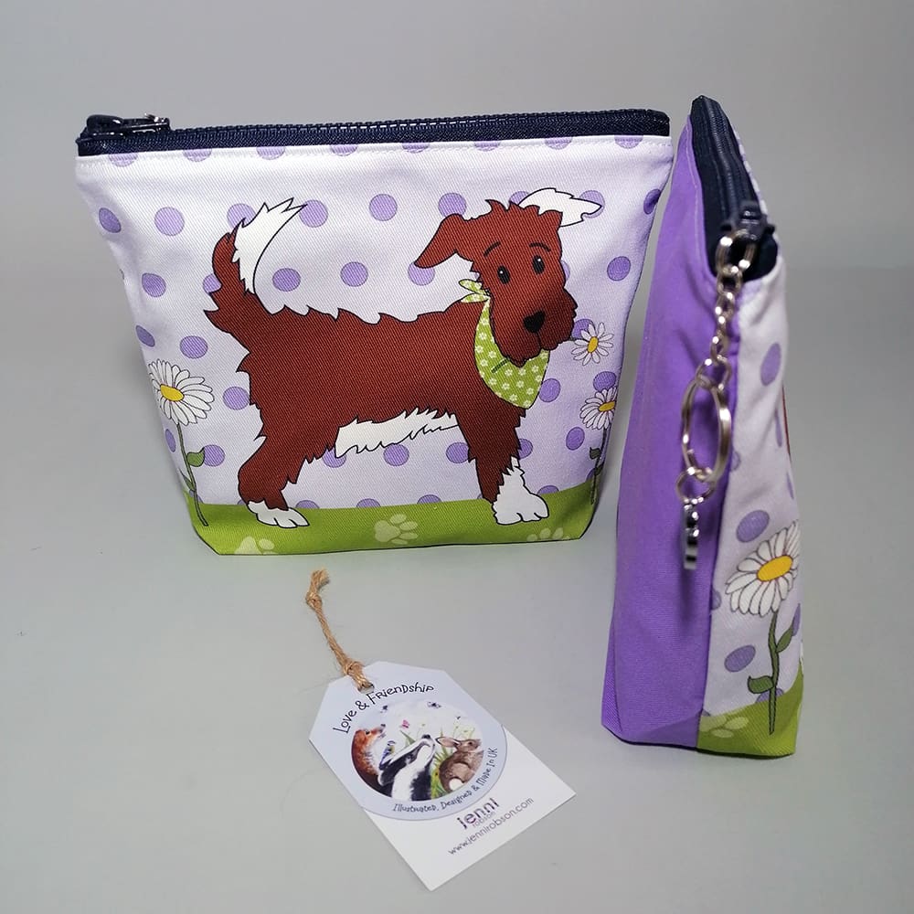 Purple and green make up purse featuring a dog-in-a-bandana print.