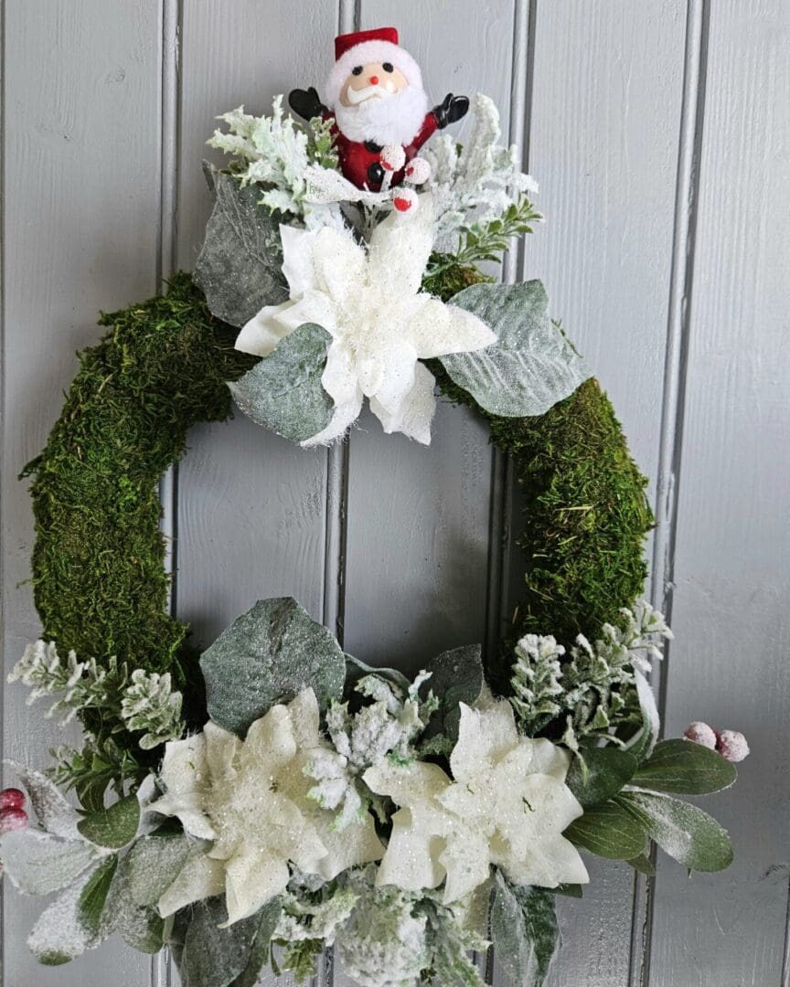 Father Christmas Wreath on a moss covered base