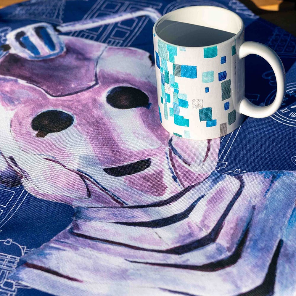 Cyberman tea towel with blue close up with mug