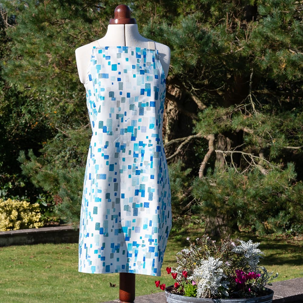 Designer cotton apron spring blue white on display