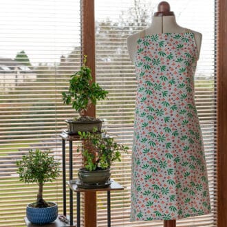 Designer cotton apron summers end floral on display