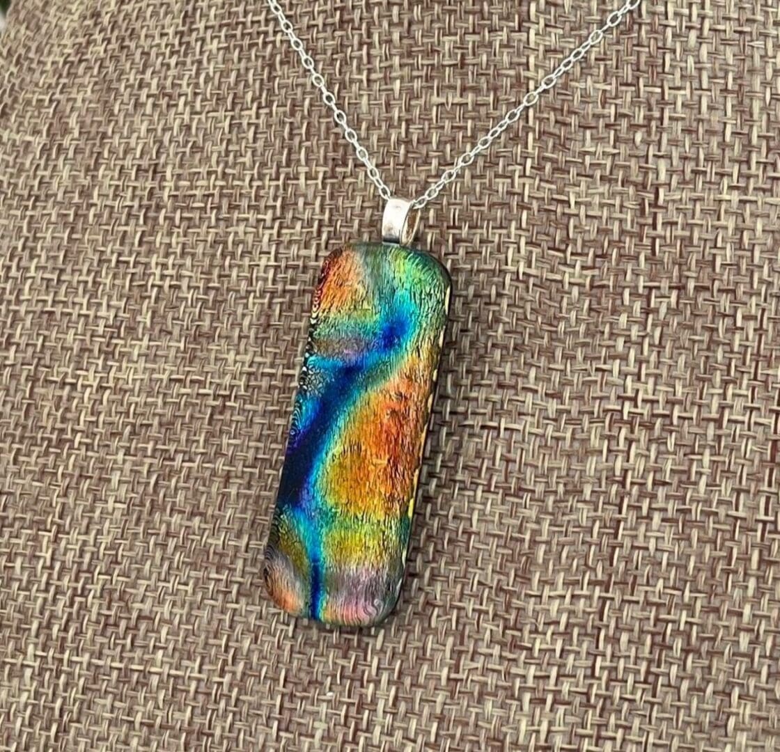 Multicoloured bright rainbow pendant dichroic fused glass