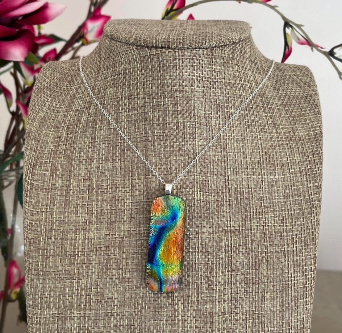 Multicoloured bright rainbow pendant dichroic fused glass