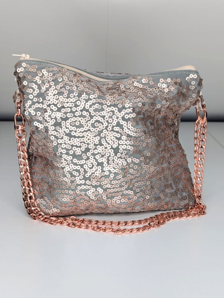 Women's fashion clutch bag with rose gold metal chain