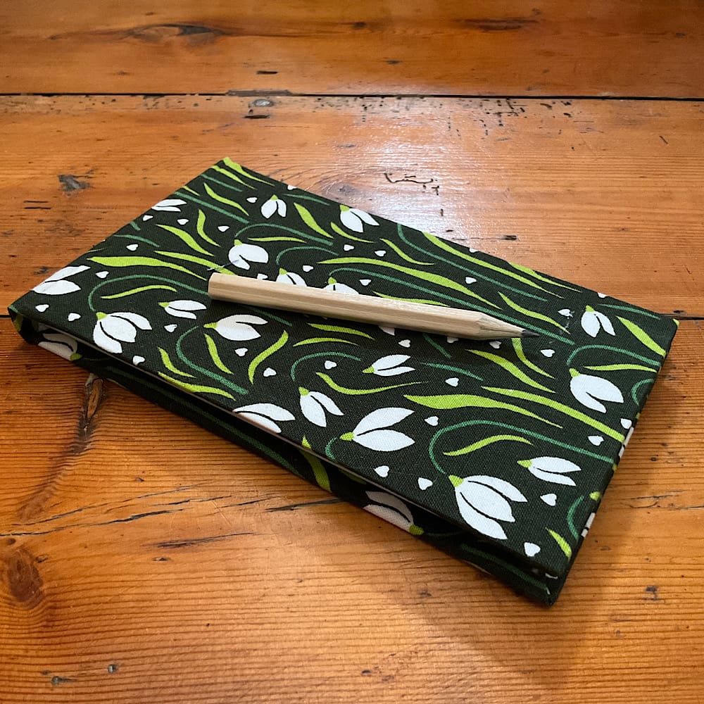 Handmade Jotter Notebook with attached pencil covered in Snowdrop f design fabric