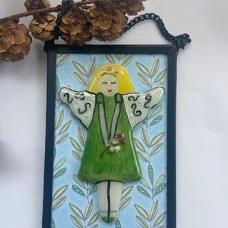 Framed fairy in a black metal frame