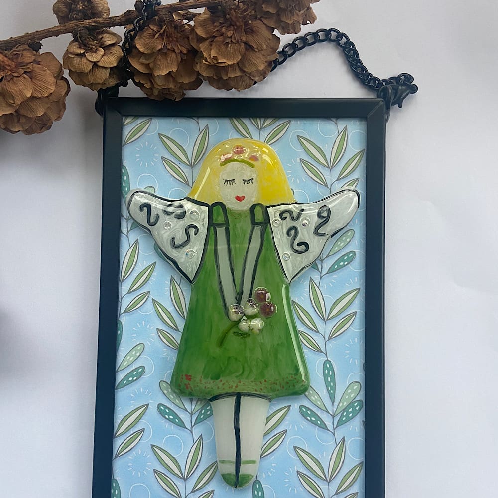 Framed fairy in a black metal frame