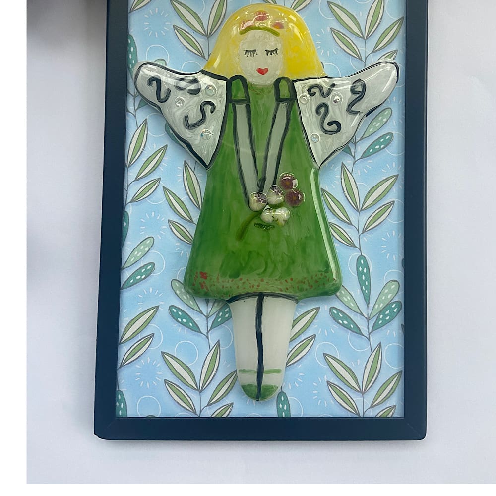 Framed fused glass fairy with a green dress