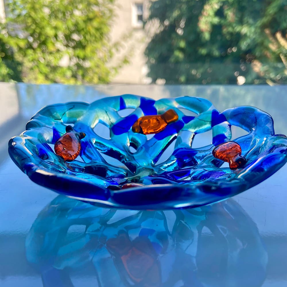 Decorative fused glass open weave bowl