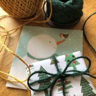 Gift wrapped with eco-friendly Christmas paper, twine and Christmas card