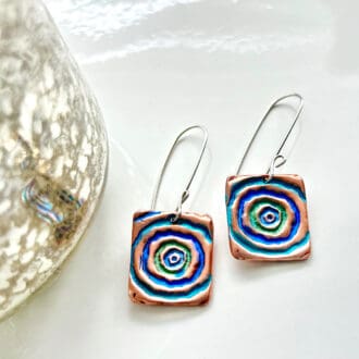 Suare copper long drop earrings with sterling silver ear wires. Hand painted with blue and Green circles in the centre.