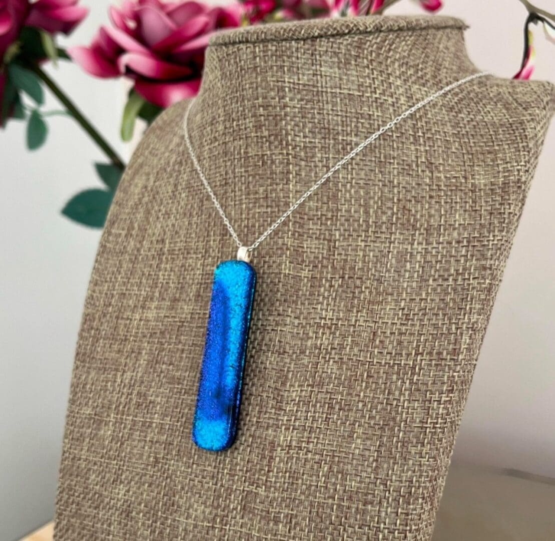 Unusual blue sparkly statement pendant