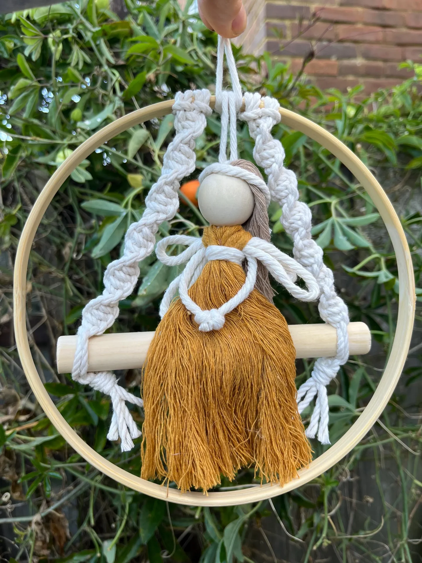 Macrame fairy on a swing hanging decoration made with recycled cotton