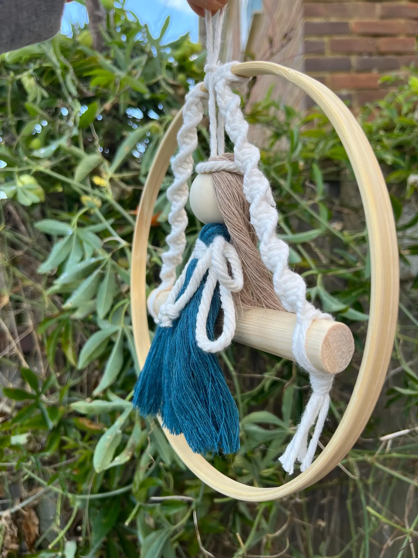 Macrame fairy on a swing hanging decoration made with recycled cotton